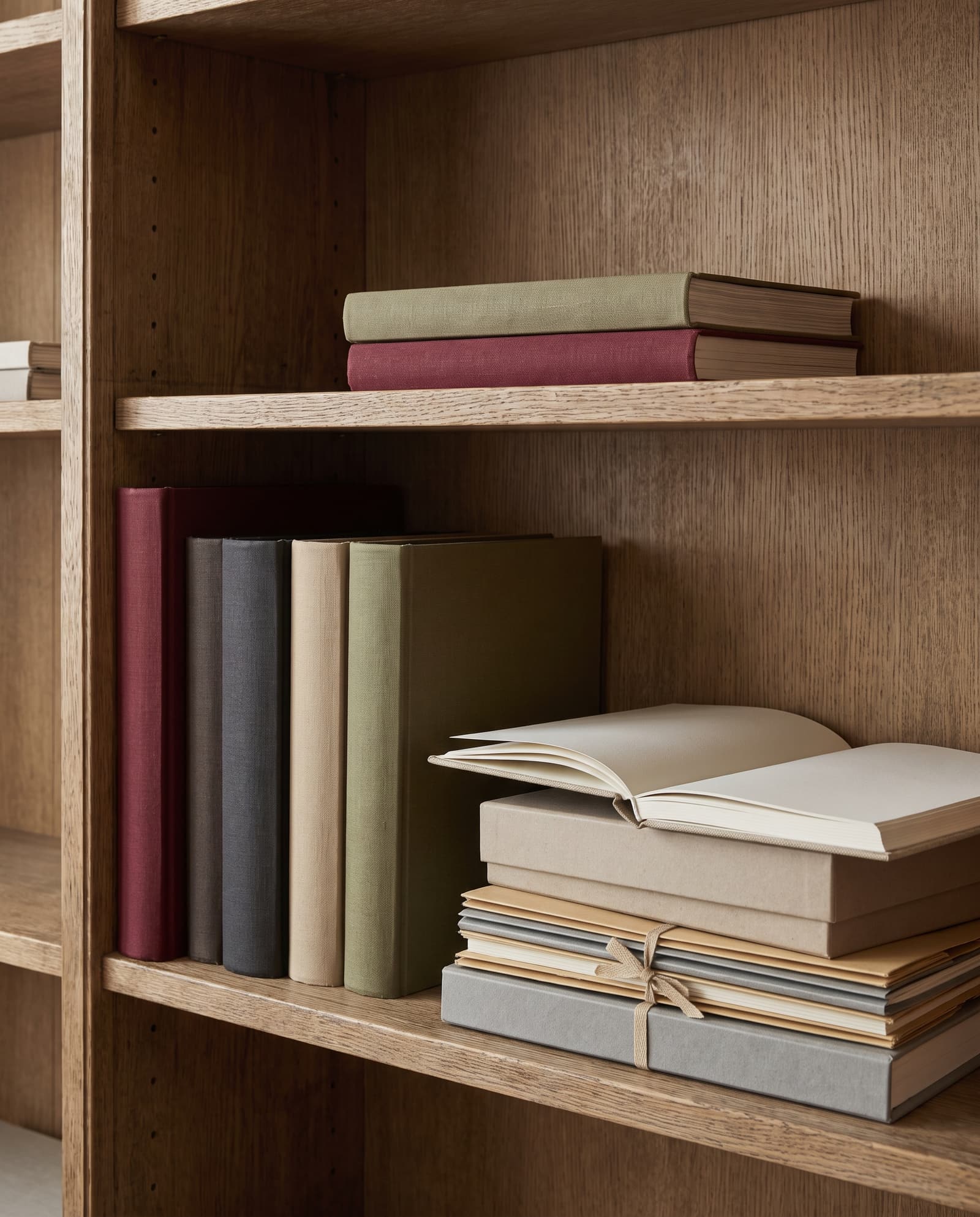 A shelf of bound brand books and archive folders